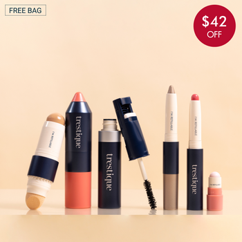 Trestique makeup set featuring foundation, blush, mascara, eyebrow pencil, and lip crayons in sleek navy packaging.