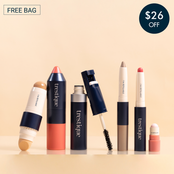 Trestique makeup set featuring foundation, blush, mascara, eyebrow pencil, and lip crayons in sleek navy packaging.